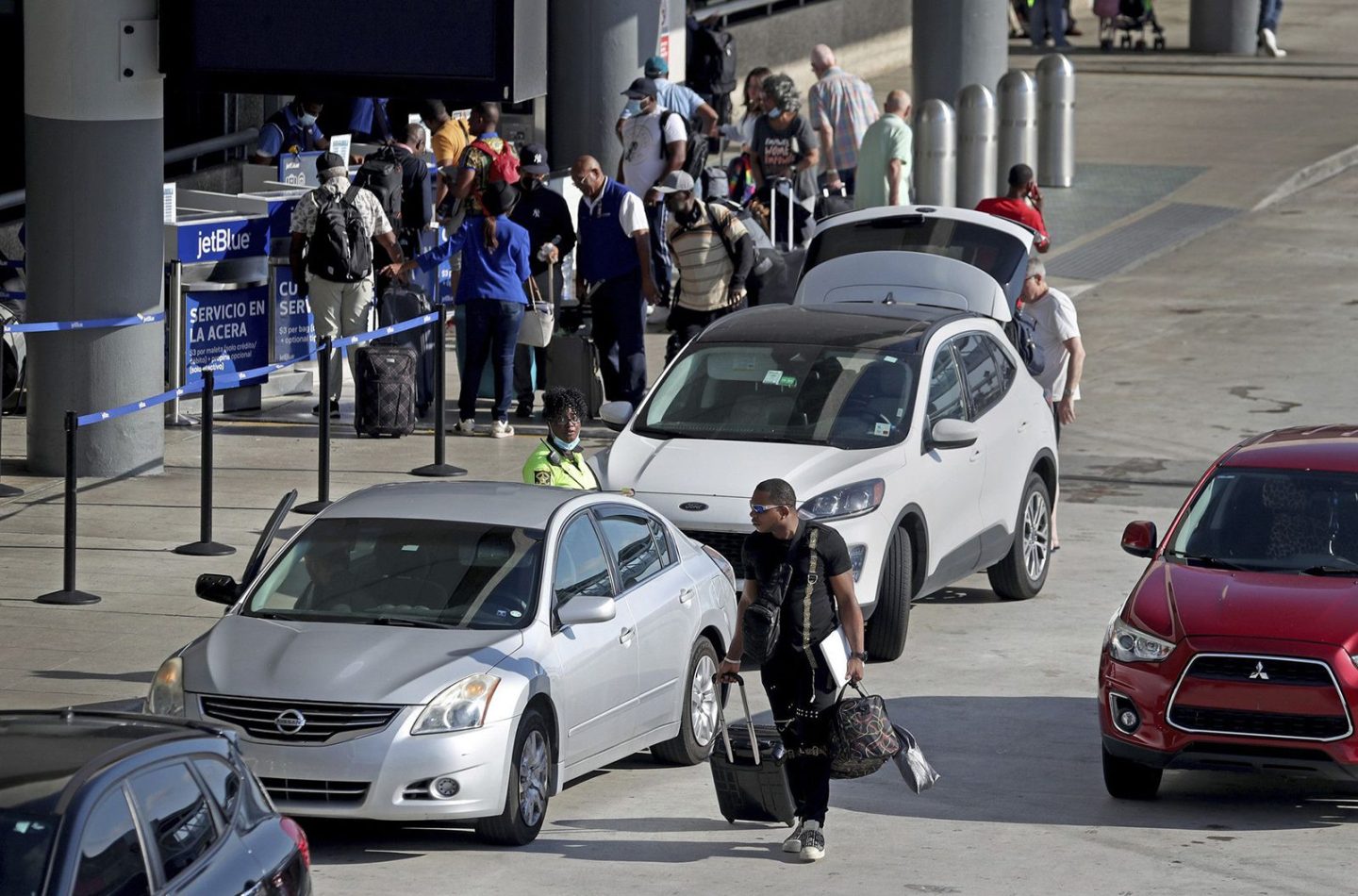 Travelers are dropped off at Fort Lauderdale/Hollywood International Airport shortly before the Memorial Day weekend