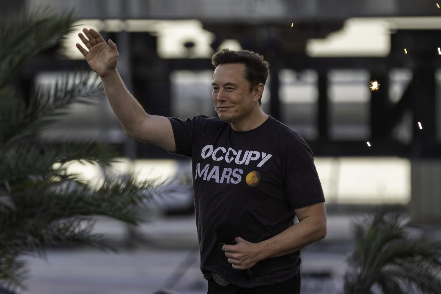 A PICTURE OF ELON MUSK WAVING