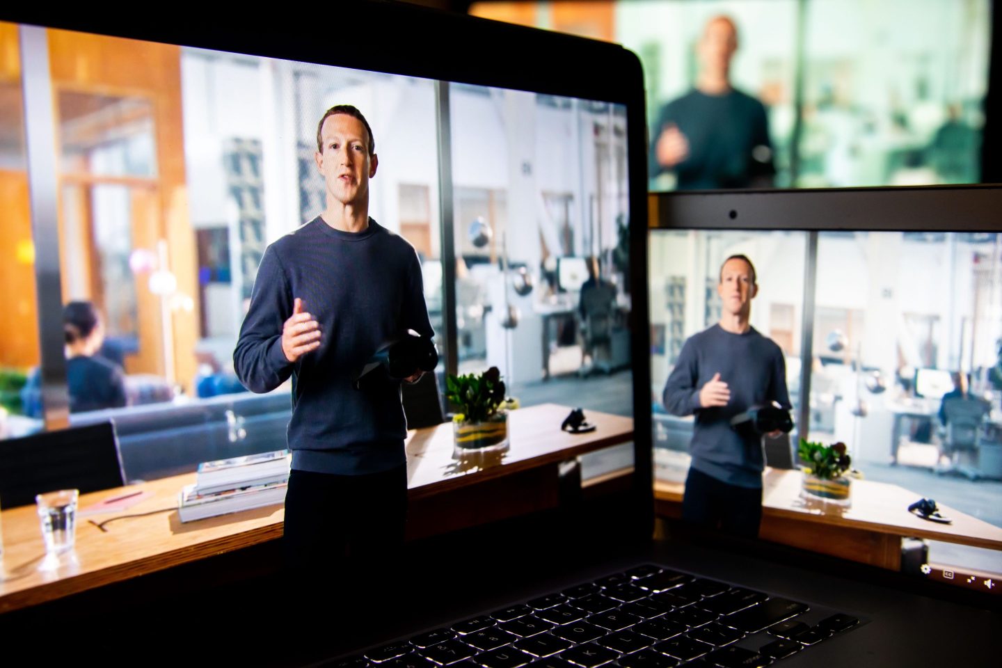 Mark Zuckerberg on three digital screens
