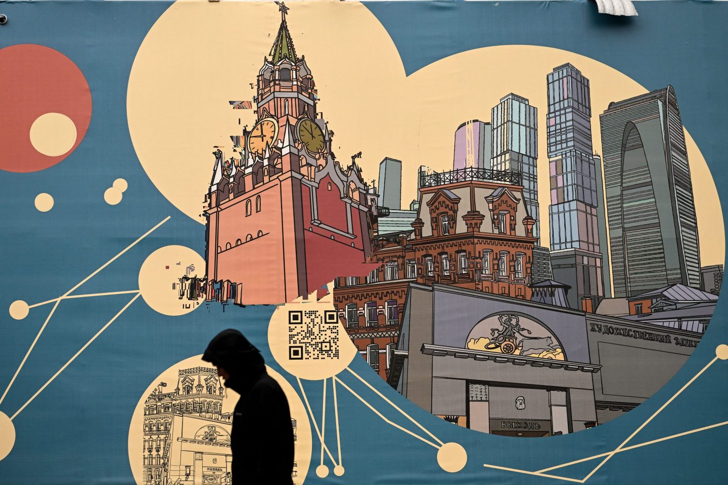 A man walks past a banner in central Moscow in October 2022.