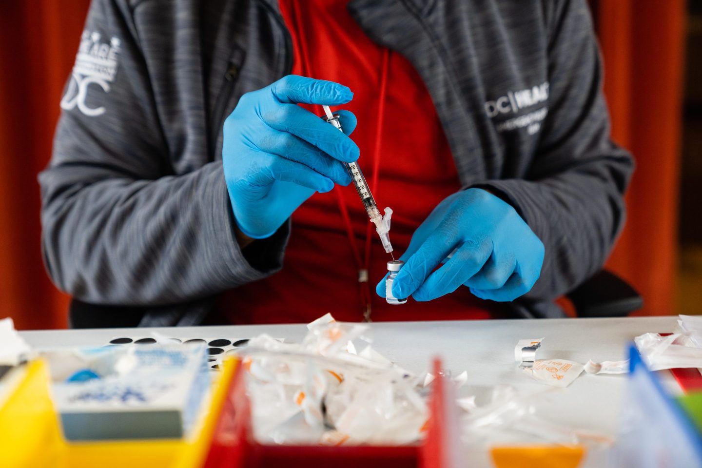 A nurse prepares a syringe with a Covid-19 vaccine, at the Peoples Congregational United Church of Christ, the site of the Ward 4 DC Covid Center, in Washington, D.C. on March 31, 2023. Friday is the last full day of DC's Covid Centers' operations