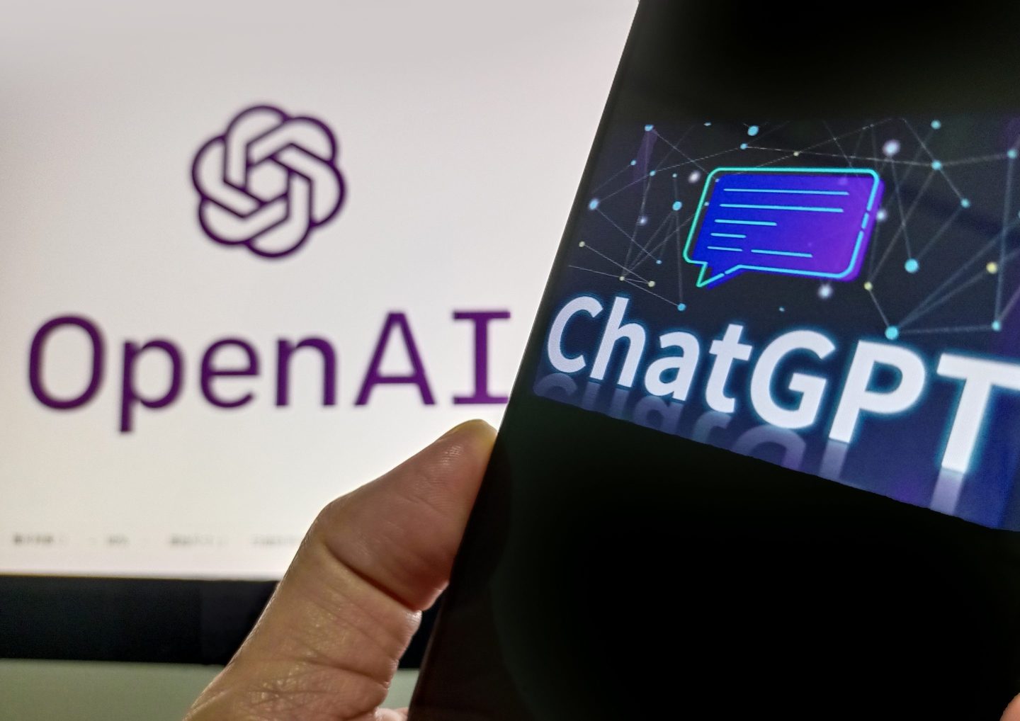 A phone screen displaying ChatGPT next to OpenAI's logo