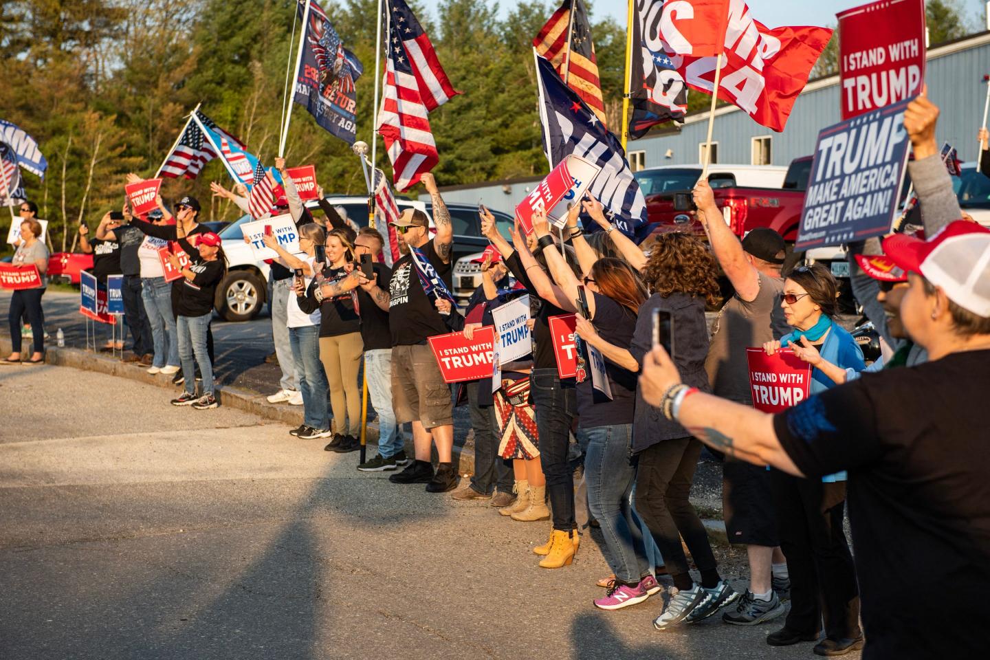 Donald Trump's supporters greeted him on his way to CNN's town hall in Manchester, New Hampshire.