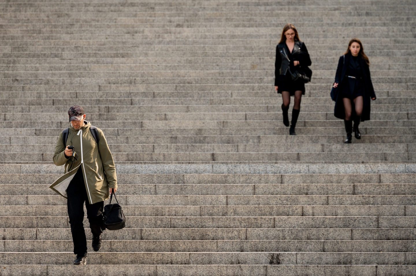 Office workers walking down stairs outside