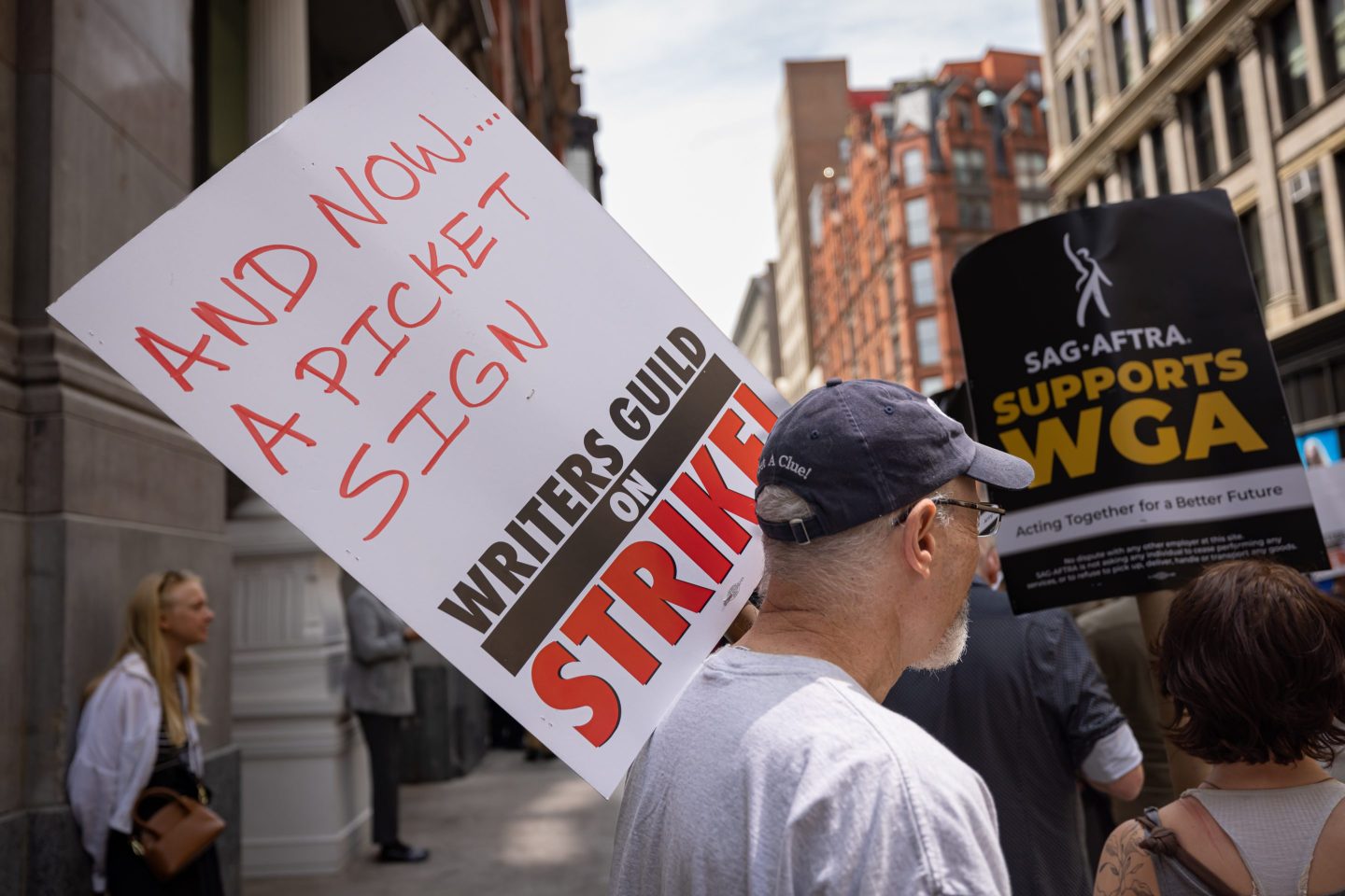 Writers Guild of America members march on a picket line in front of Netflix offices in New York on May 19. After contract negotiations failed, thousands of unionized writers voted unanimously to strike, bringing television production to a halt, and initiating the first walkout in 15 years.