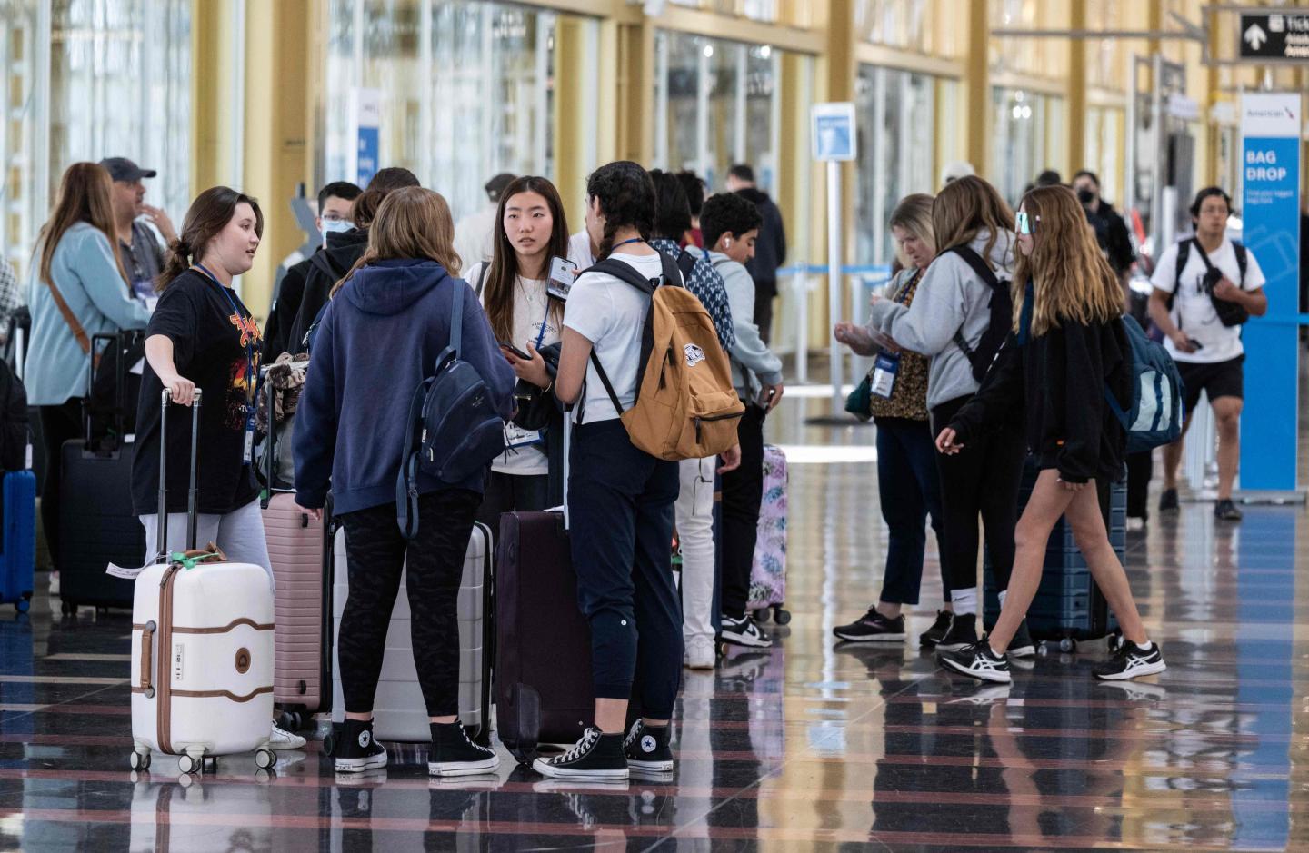 A group of travelers standing with their luggage