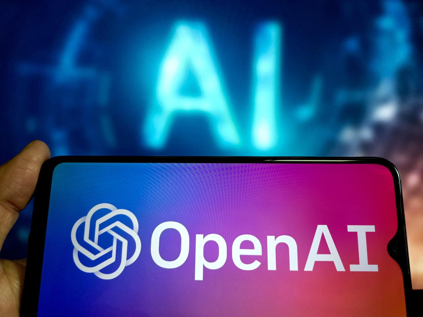 OpenAI logo on a phone screen