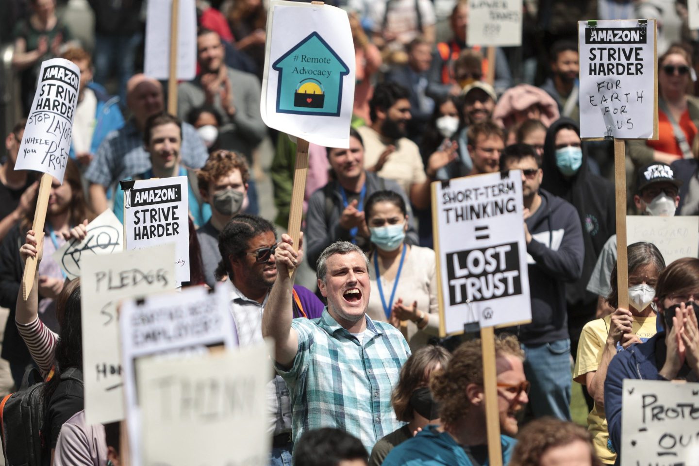 Amazon employees and supporters gather during a walk-out protest against recent layoffs, a return-to-office mandate, and the company&#8217;s environmental impact, outside Amazon headquarters in Seattle, Washington, on May 31, 2023. (Photo by Jason Redmond / AFP) (Photo by JASON REDMOND/AFP via Getty Images)