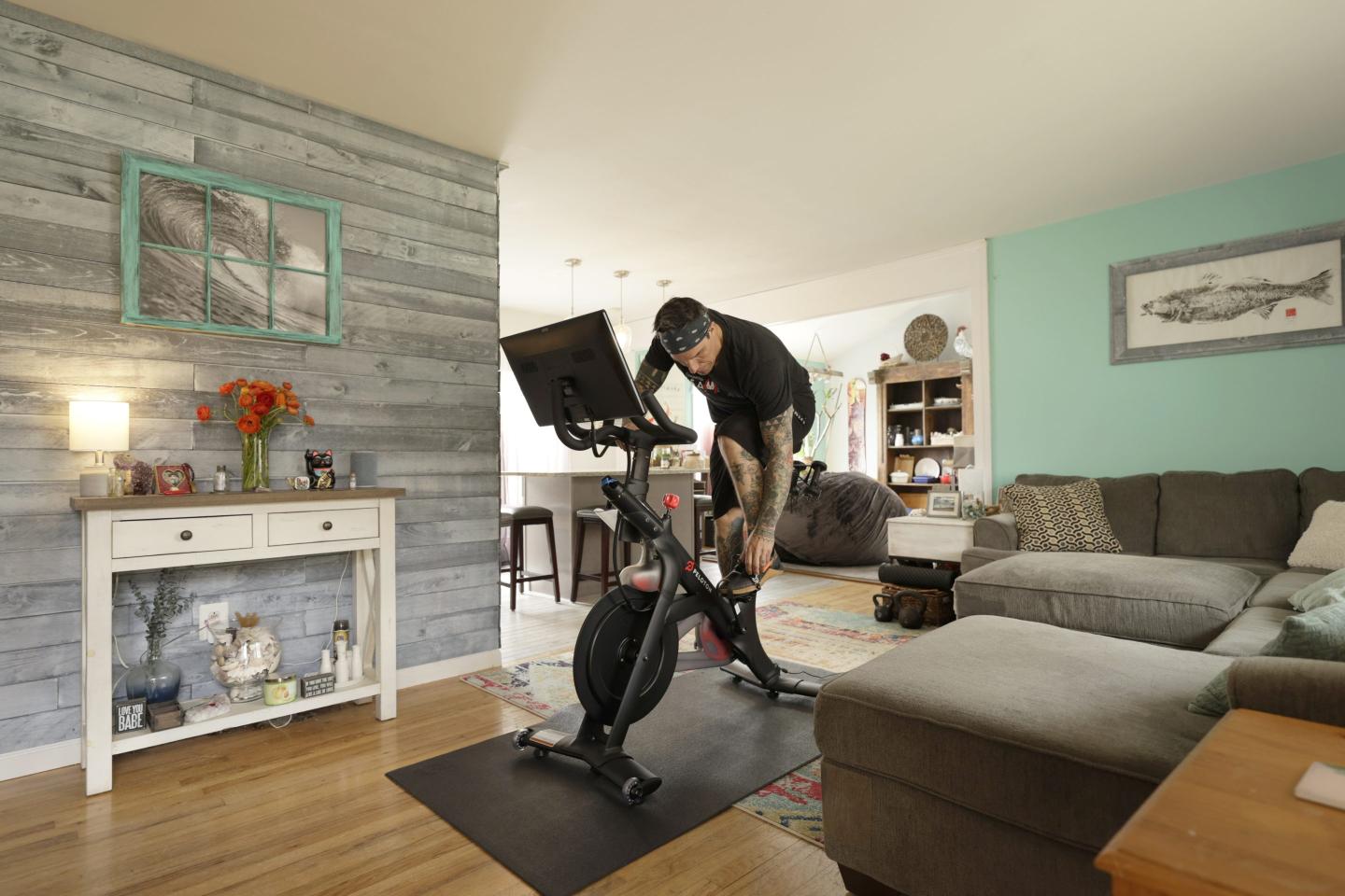 Brody Longo prepares to work out on his Peloton exercise bike on April 16, 2021 in Brick, New Jersey.