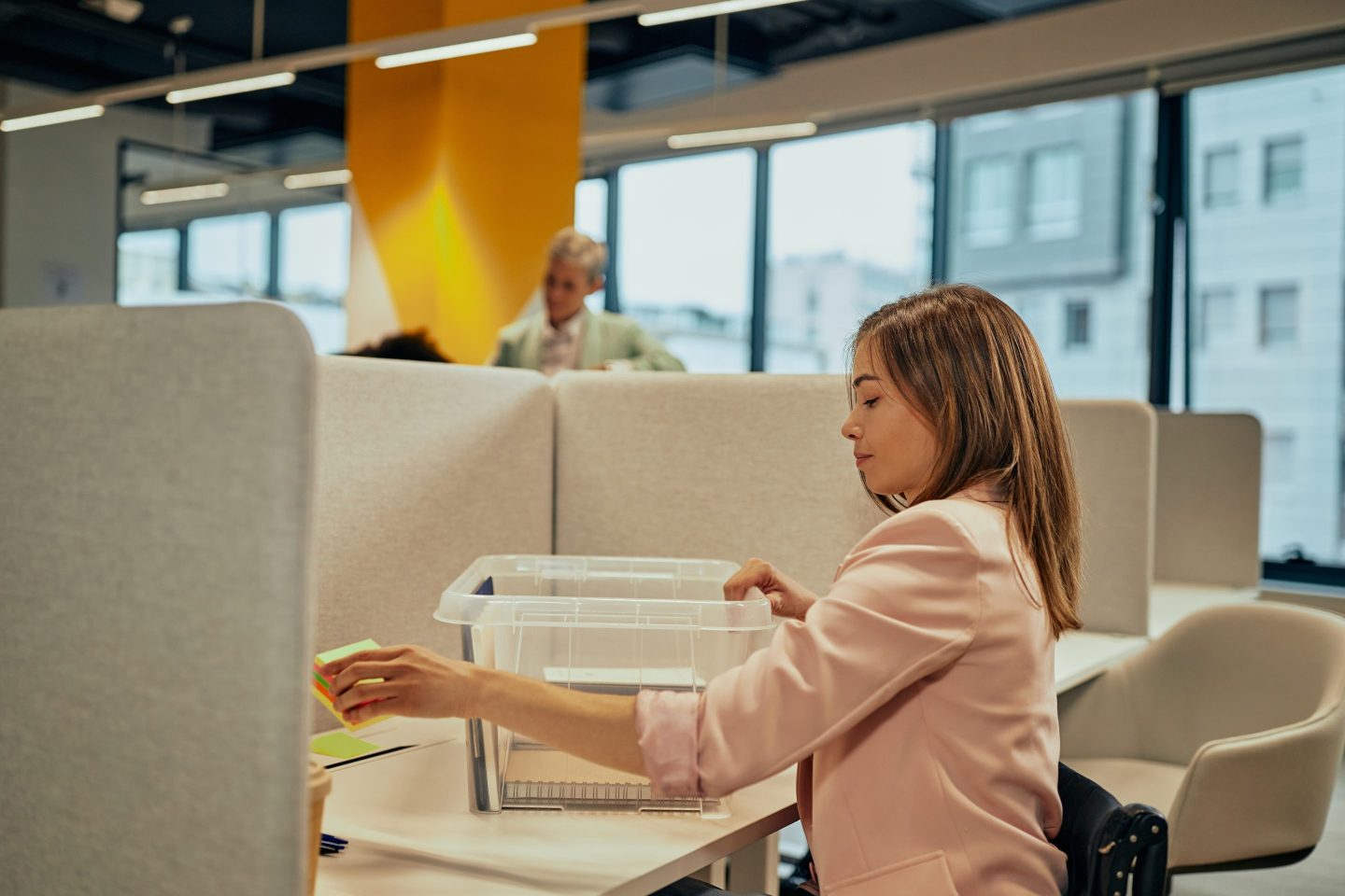 woman packing up desk