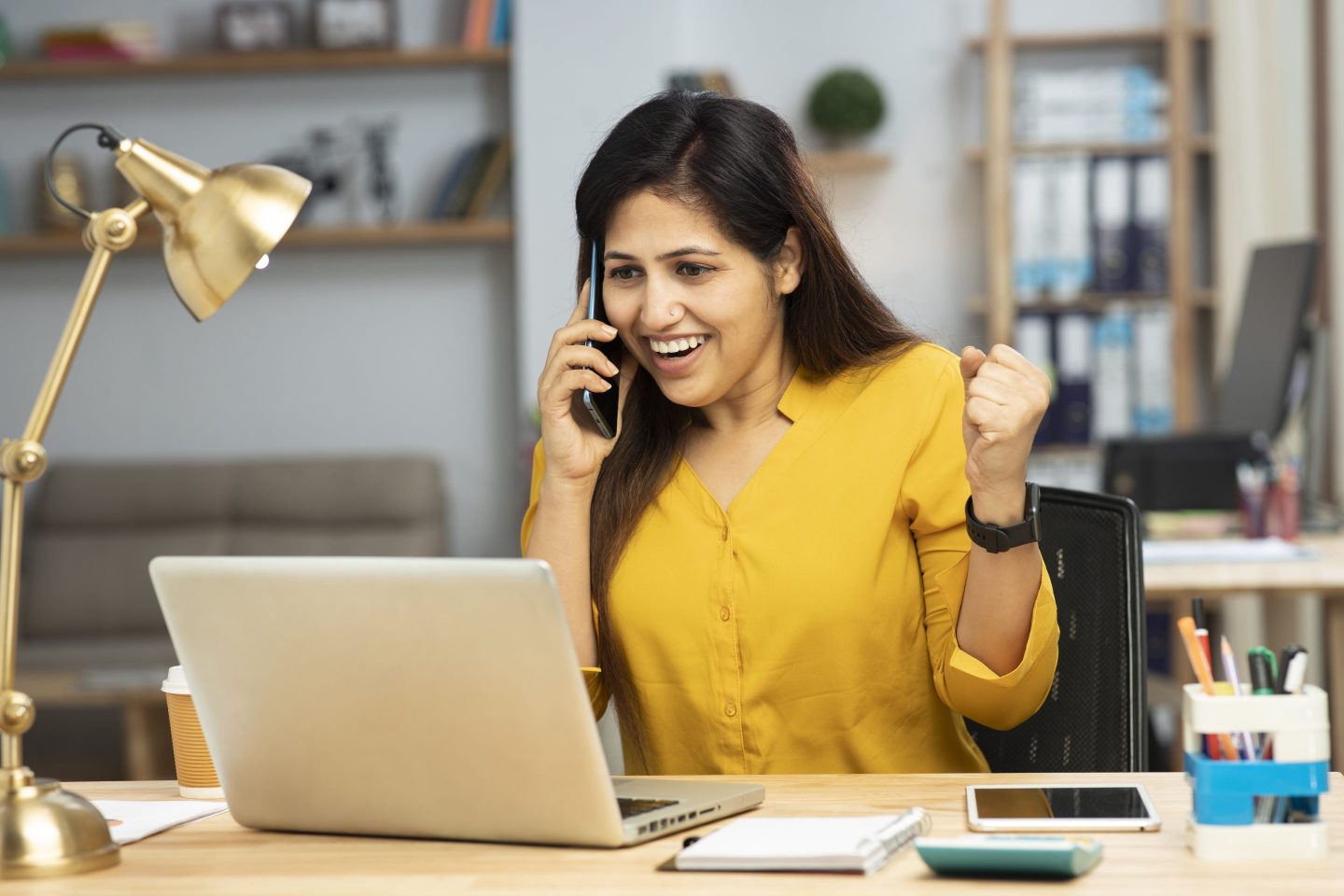 Woman happy at her laptop