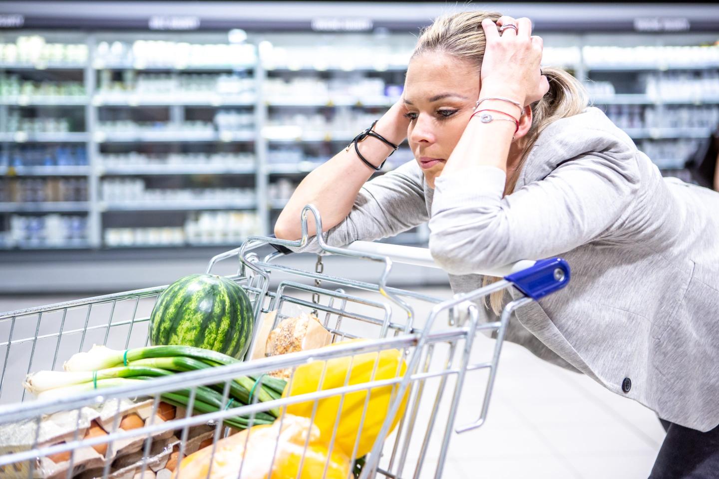 Americans are showing signs of financial stress as they add $148 billion in debt and fail to pay off their credit cards