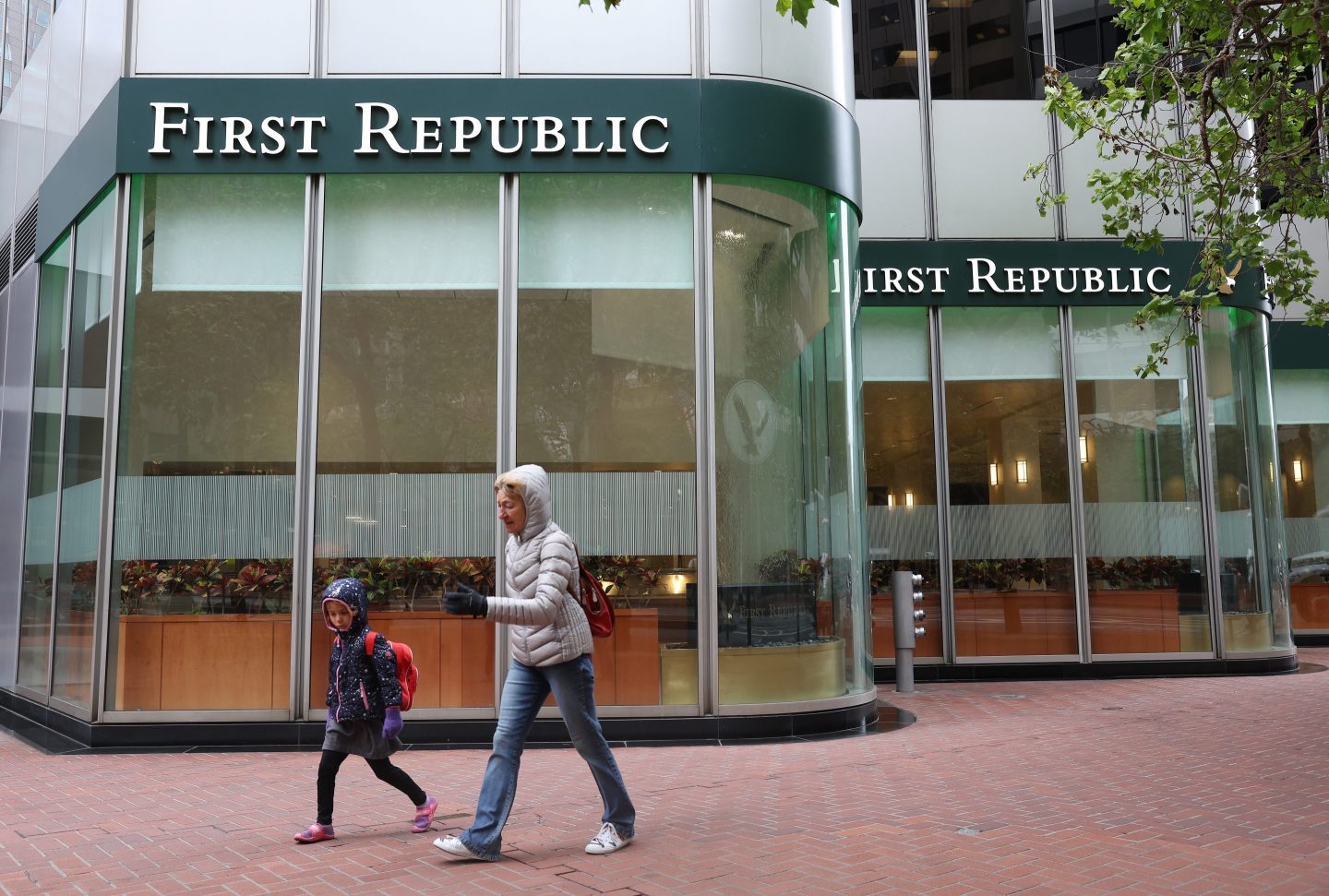 People walk by a First Republic Bank office on May 01, 2023 in San Francisco, California. Federal Regulators seized troubled lender First Republic Bank on Monday and sold all of its deposits and most of its assets to JPMorgan Chase.