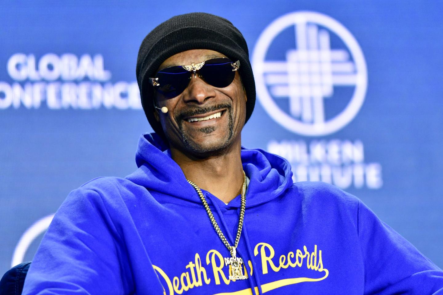 Snoop Dogg on stage at the 2023 Milken Institute Global Conference