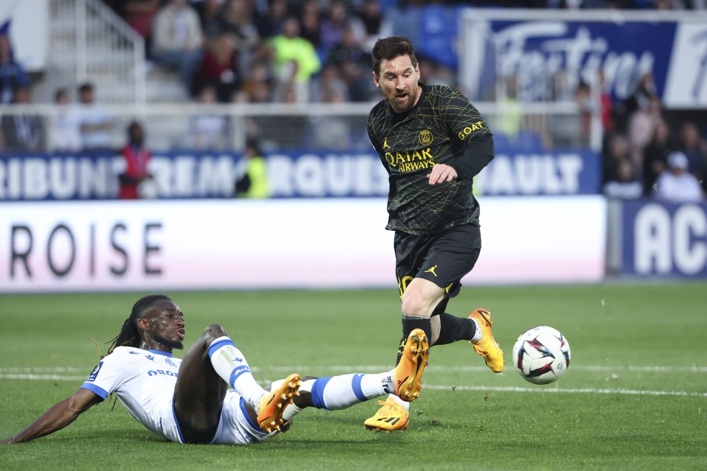Lionel Messi of PSG, left Gideon Mensah of Auxerre during the Ligue 1 Uber Eats match between AJ Auxerre (AJA) and Paris Saint-Germain (PSG) at Stade de l'Abbe Deschamps on May 21, 2023 in Auxerre, France.