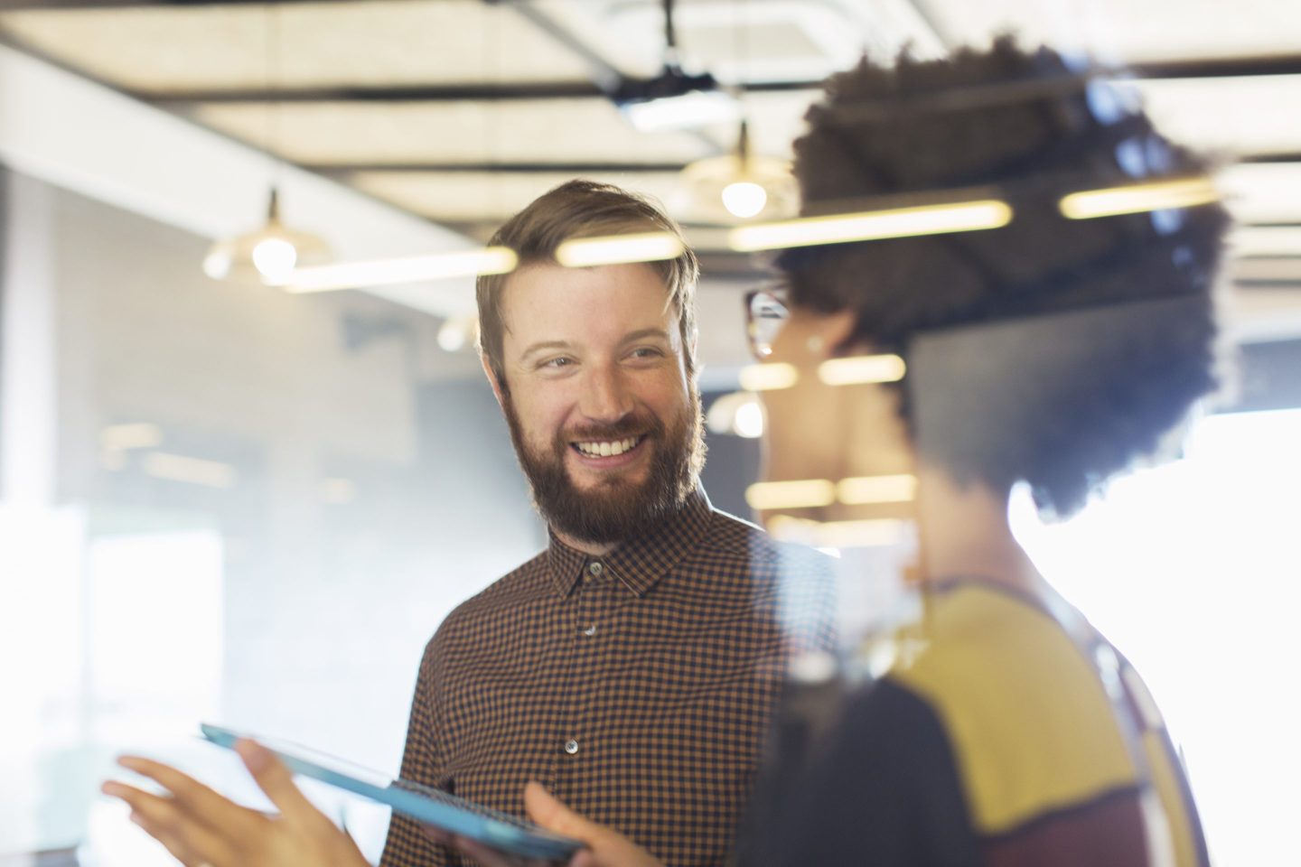 Workers collaborating in office