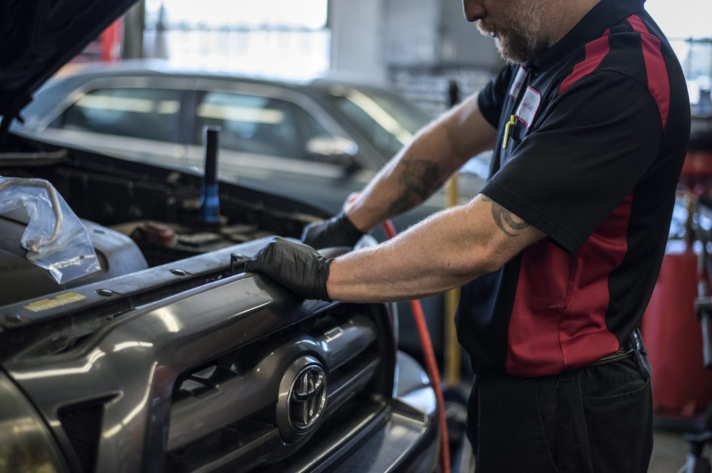 A mechanic works on a truck inside a Chevron Corp. gas station in Albuquerque