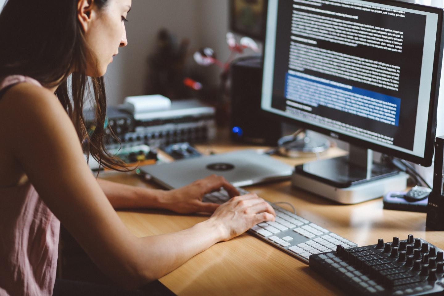 A person typing on a keyboard