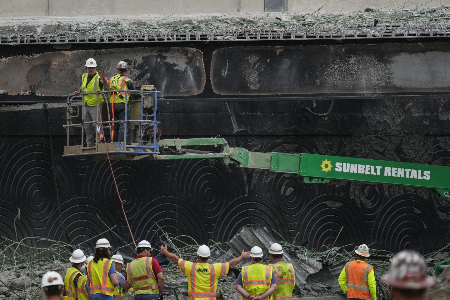 Crews work at the site of a collapsed elevated section of Interstate 95 in Philadelphia, June 14, 2023.