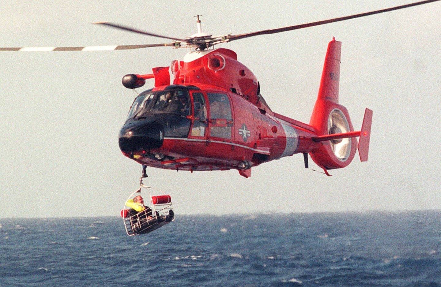 Balloonist Steve Fossett is retrieved by a U.S. Coast Guard helicopter from waters 10-15 miles north of the island of Oahu in the Hawaiian Islands, Dec. 25, 1998, after abandoning his quest along with Per Lindstrand, of Sweden, and British mogul Richard Branson, who were attempting to make the first nonstop round-the-world flight in a balloon.