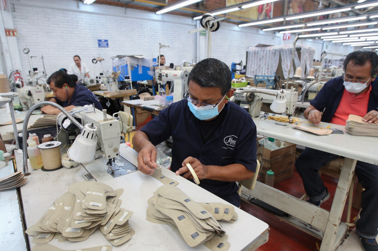 A man works in a shoe maquiladora or factory, in Leon, Mexico, on Feb. 7, 2023.