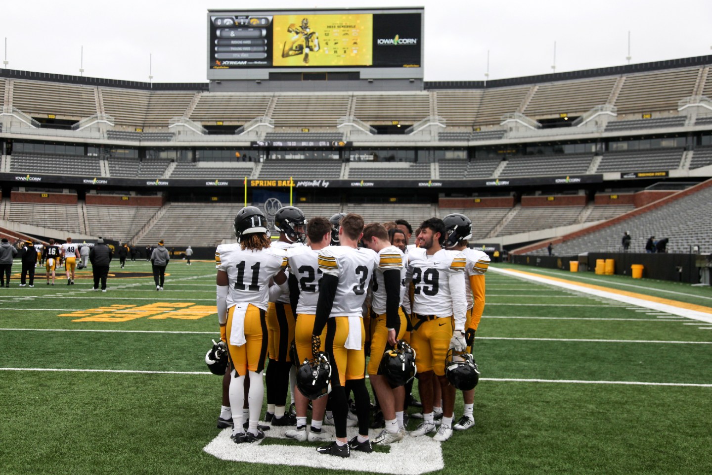 The Iowa Hawkeyes secondary huddles together during the Iowa Spring Open Practice at Kinnick Stadium.