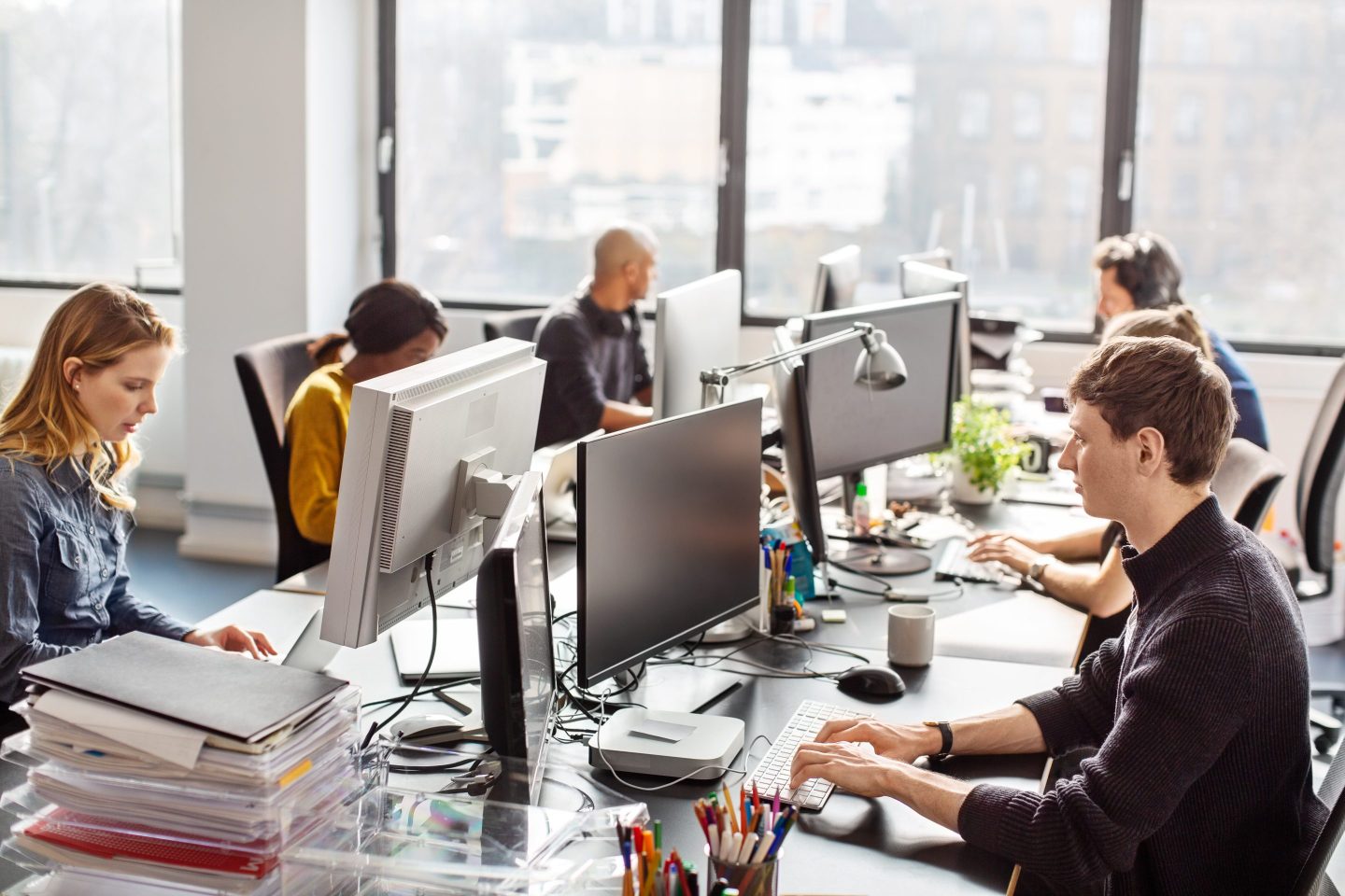A group of people working at a co-working space