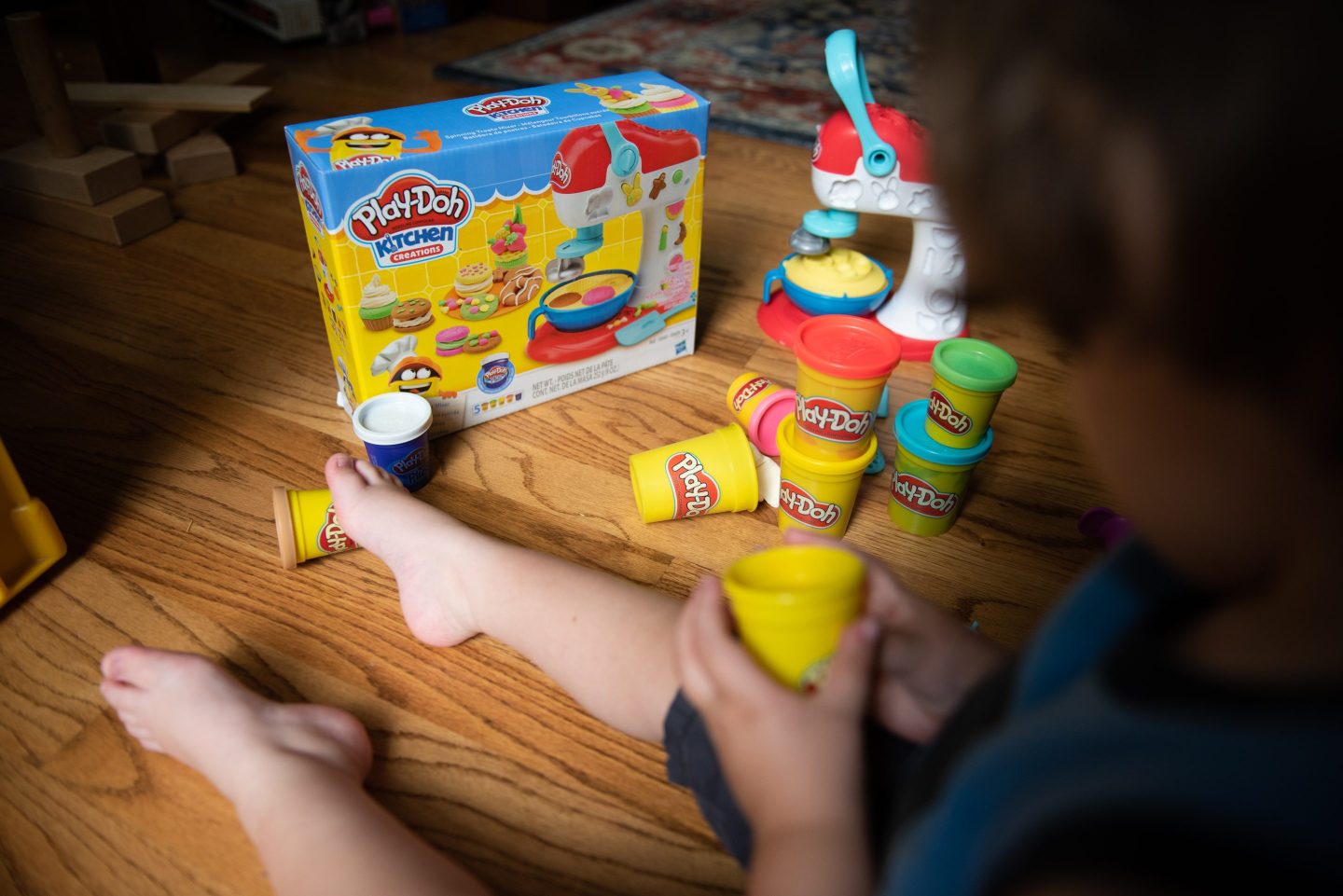 A picture of a kid playing with play-doh