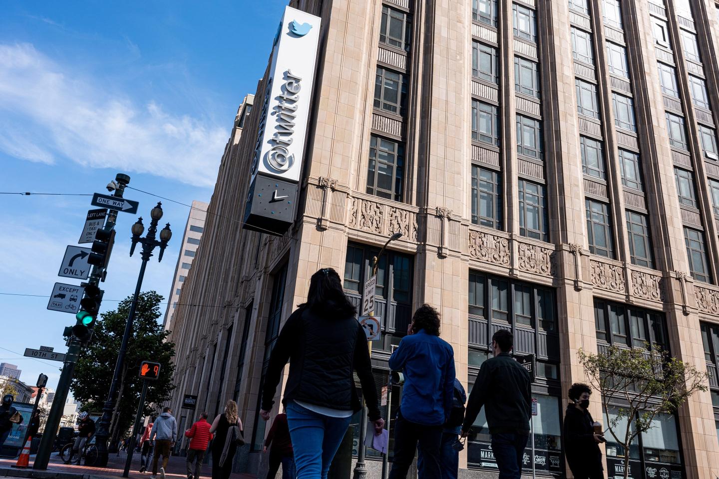 People walking outside Twitter's headquarters