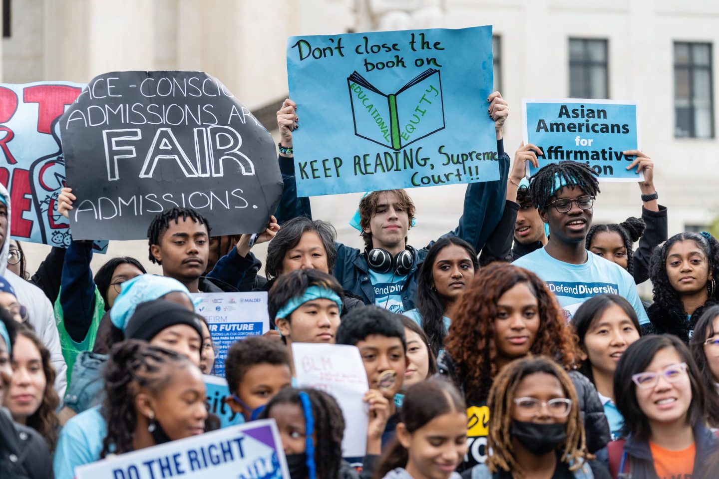 Supporters pose for a group photo during a rally in support of affirmative action policies outside the Supreme Court in Washington, D.C., on Oct. 31, 2022.