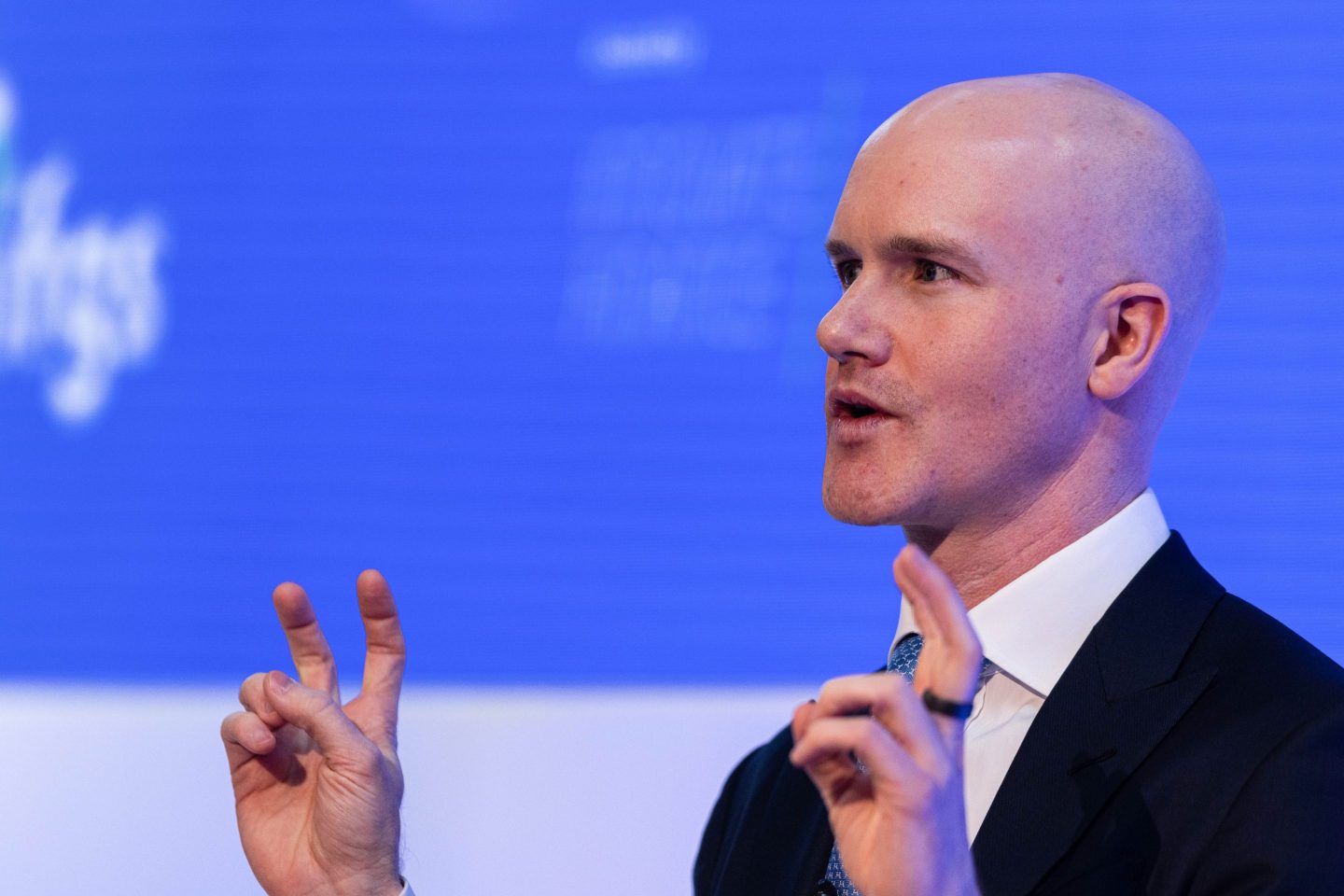 Brian Armstrong, the founder and CEO of Coinbase, speaks on stage during an April conference in the U.K.