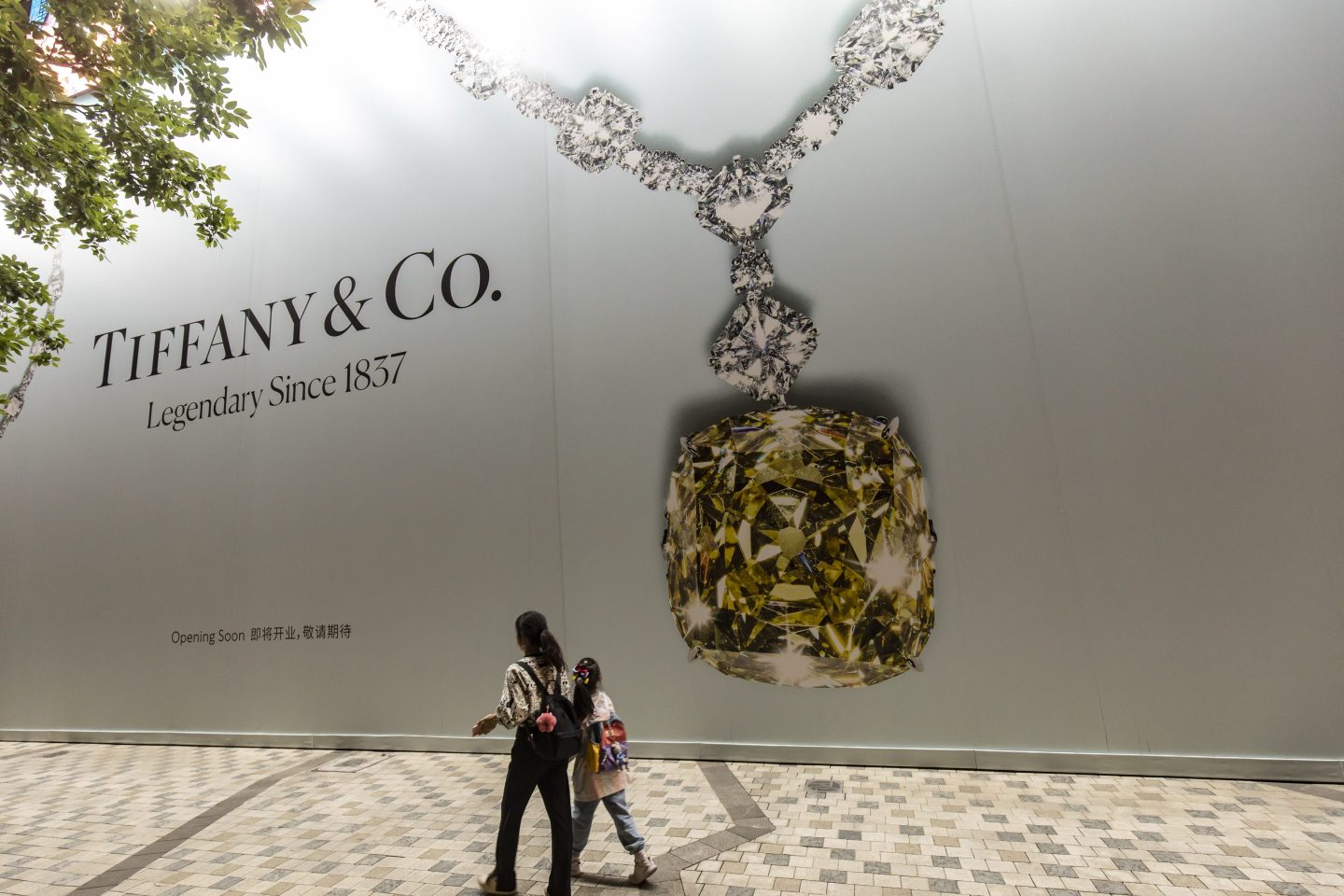 Visitors walk past a future Tiffany & Co. luxury jewelry store in Shanghai, China, in April.