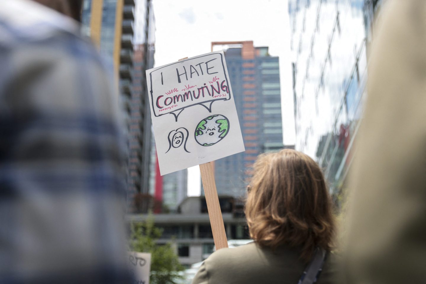 Amazon employees gather during a walkout protest against a return-to-office mandate, recent layoffs, and the company's environmental impact outside headquarters in Seattle on Wednesday.