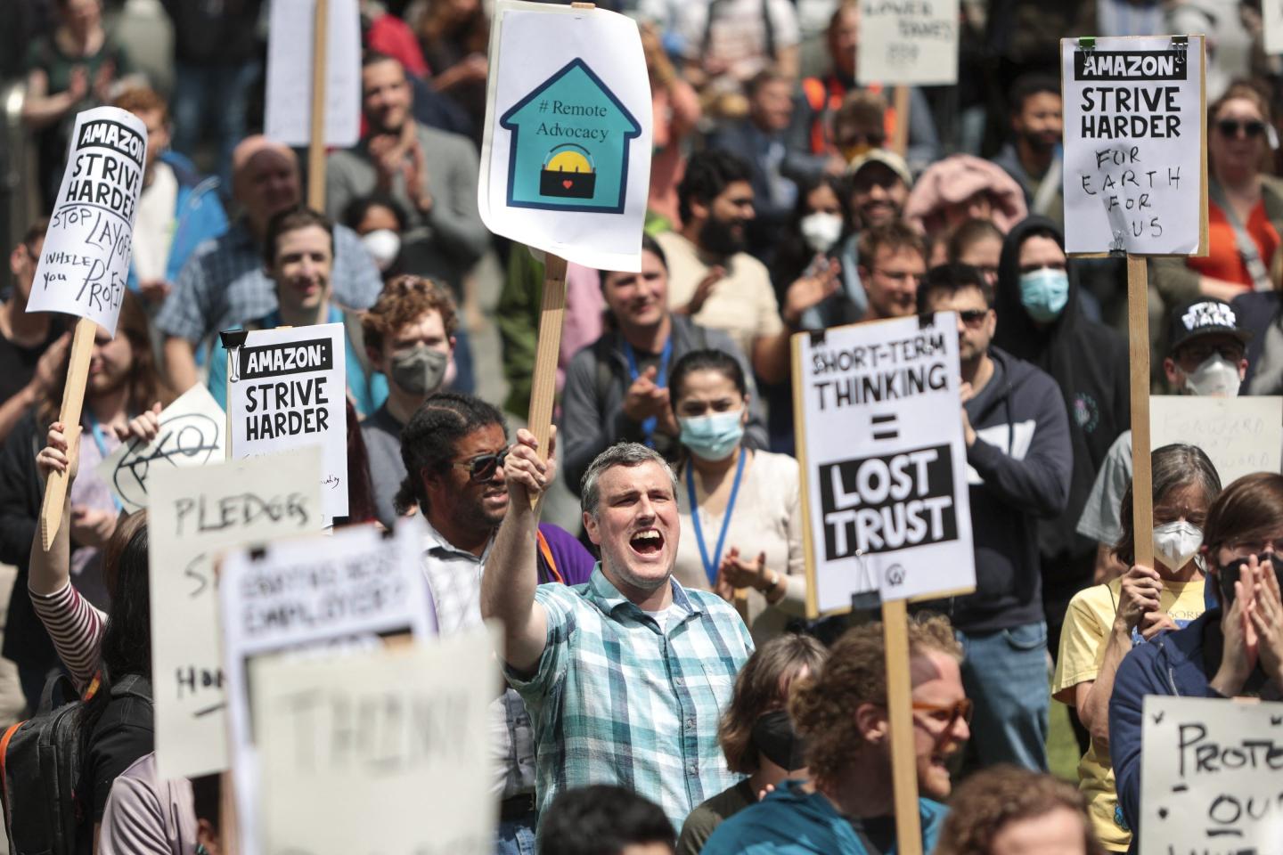 Amazon employees hold a walk-out protest against recent layoffs, a return-to-office mandate, and the company's environmental impact, outside Amazon headquarters in Seattle on May 31.