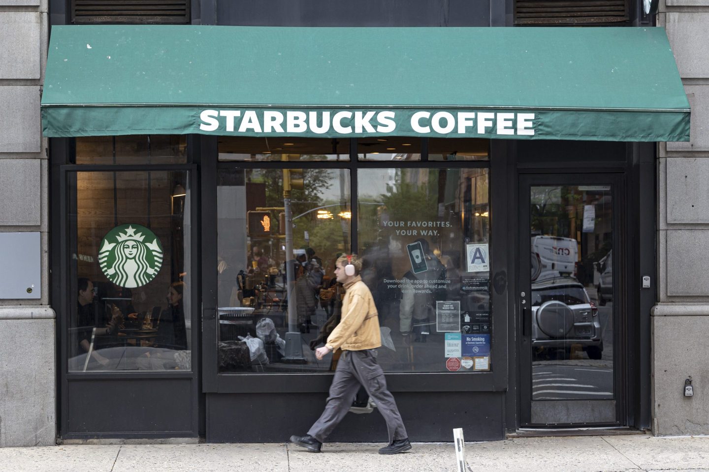 Starbucks denies claims that stores are banning Pride decorations.