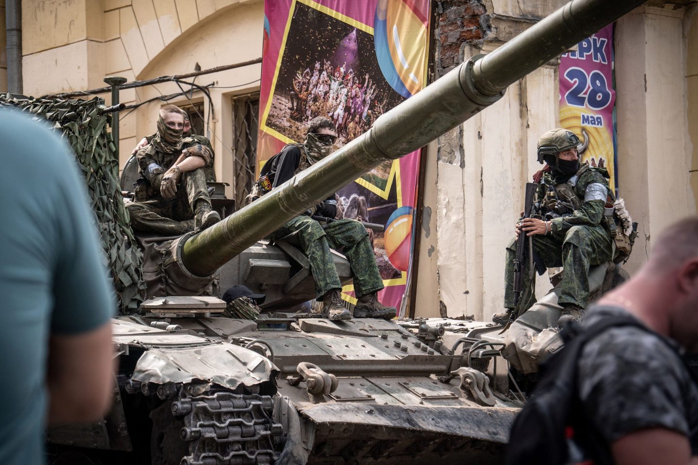 Members of Wagner group sit atop of a tank in a street in the city of Rostov-on-Don on Saturday.