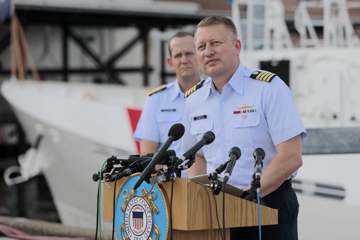 U.S Coast Guard Captain Jason Neubauer, right, and Rear Admiral John Mauger hold a press briefing on the conclusion of the search and rescue mission to find the Titan.