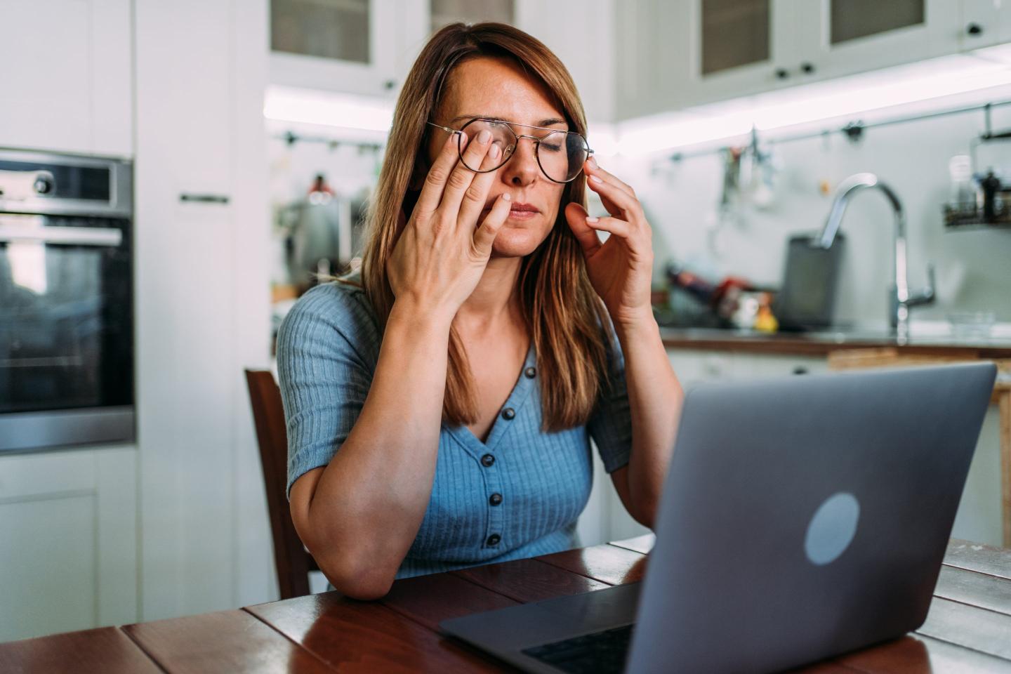 Woman working from home appears to be stressed out