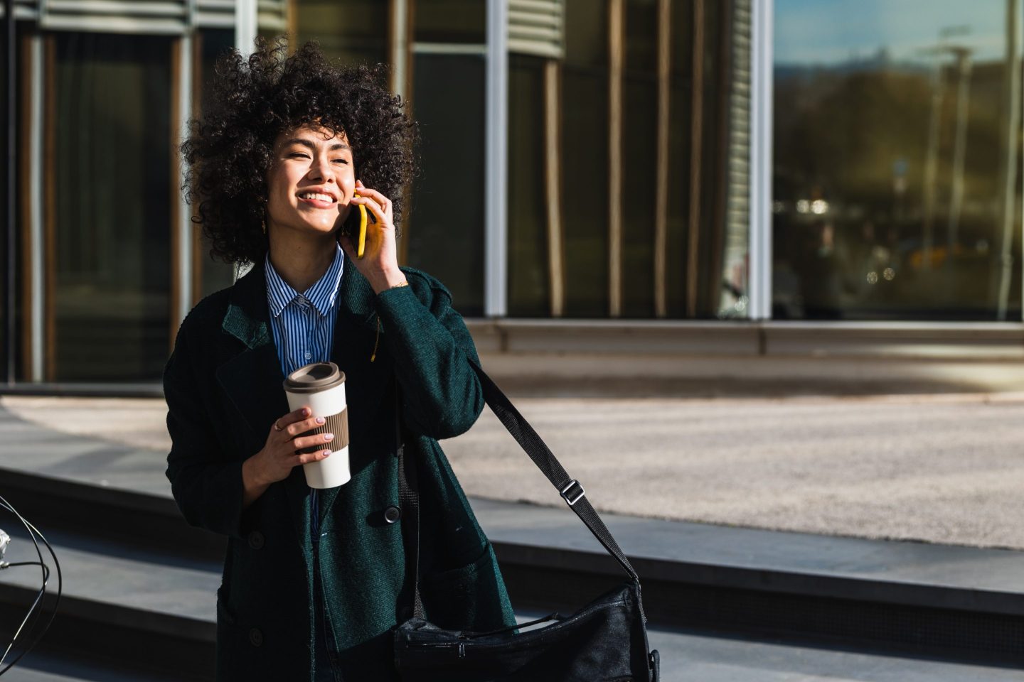 Woman happy while drinking coffee