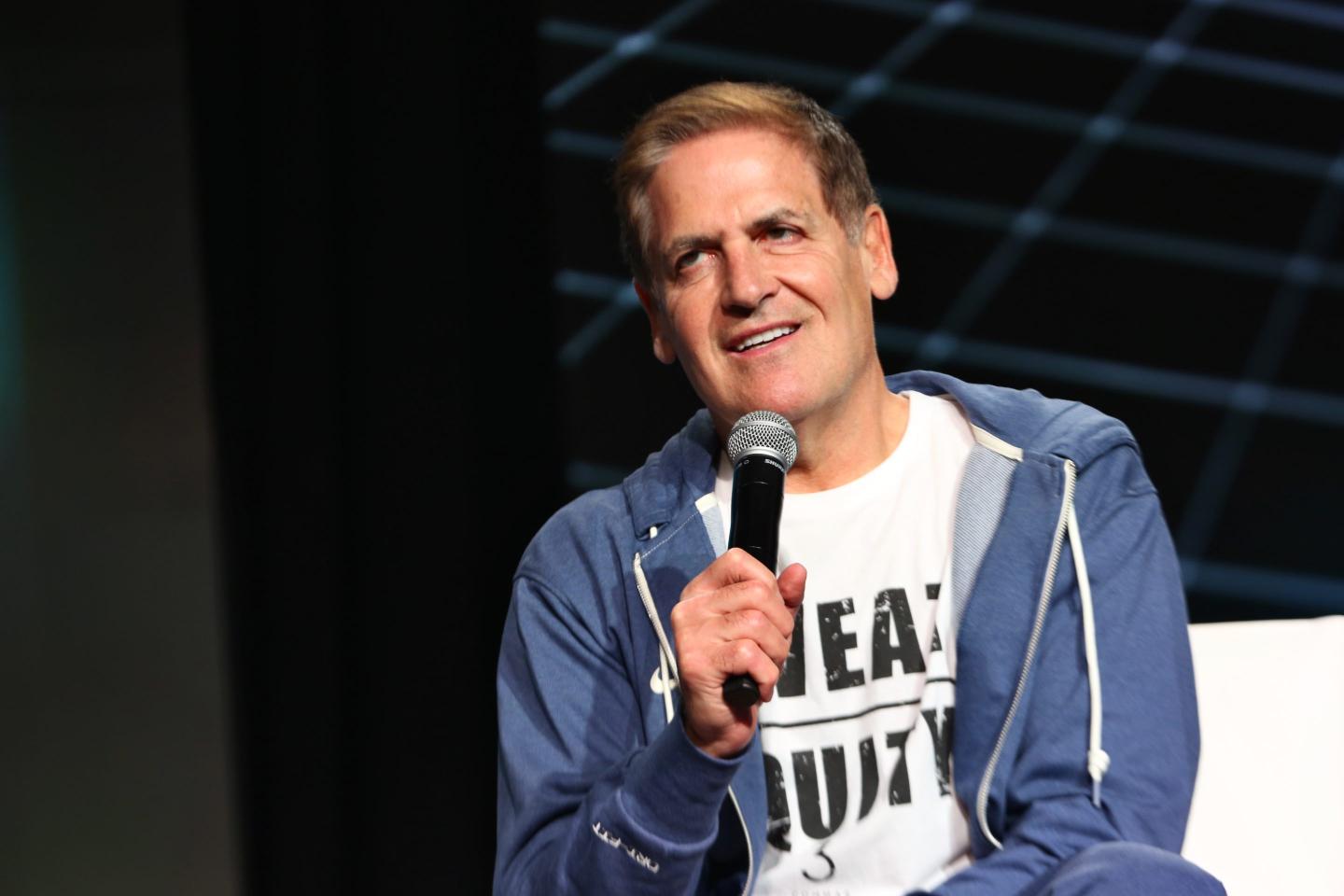 Mark Cuban holding a microphone