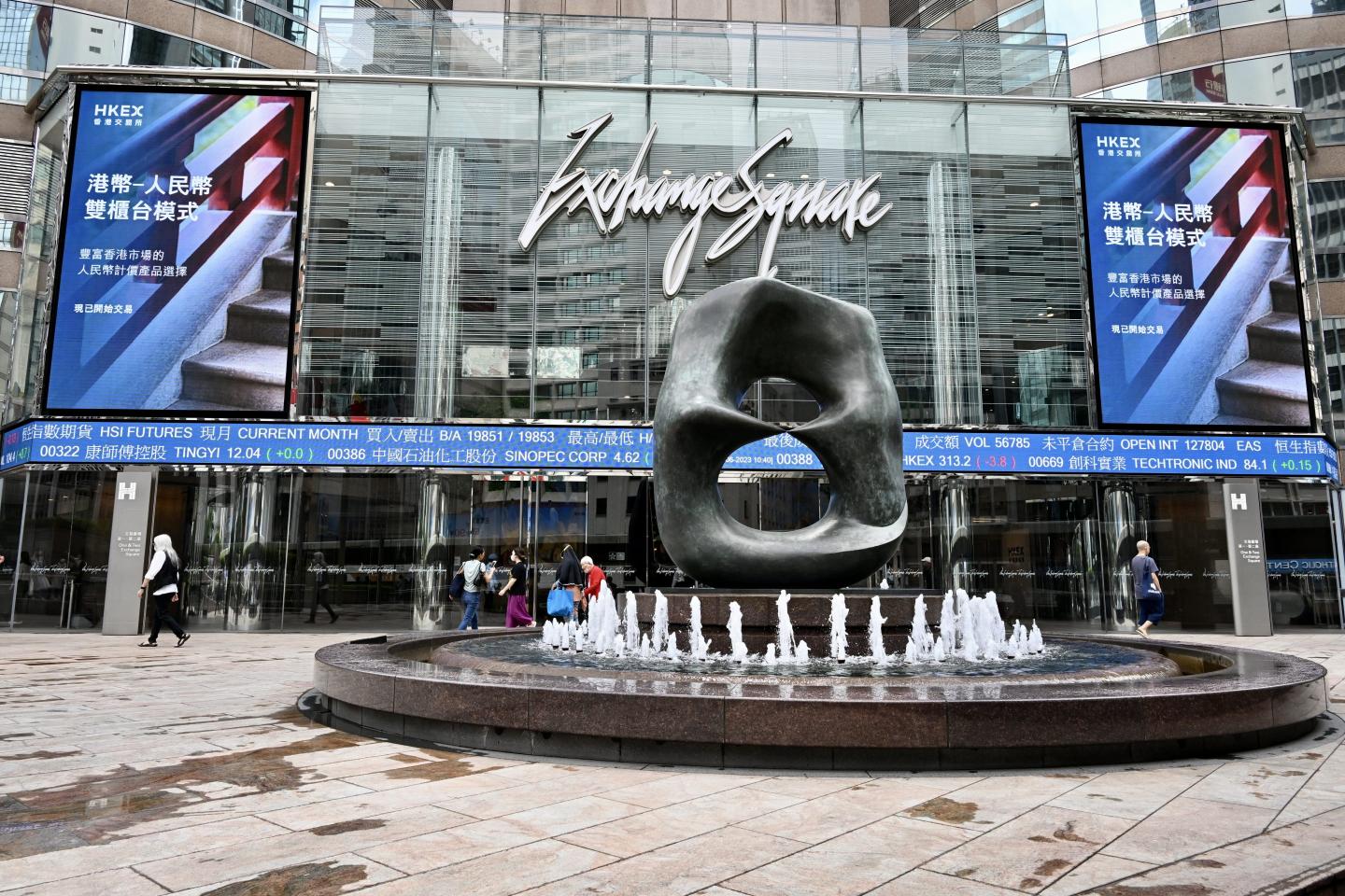 Hong Kong stock exchange debuts yuan-denominated shares as China speeds up push to internationalize its currency and replace the U.S. dollar