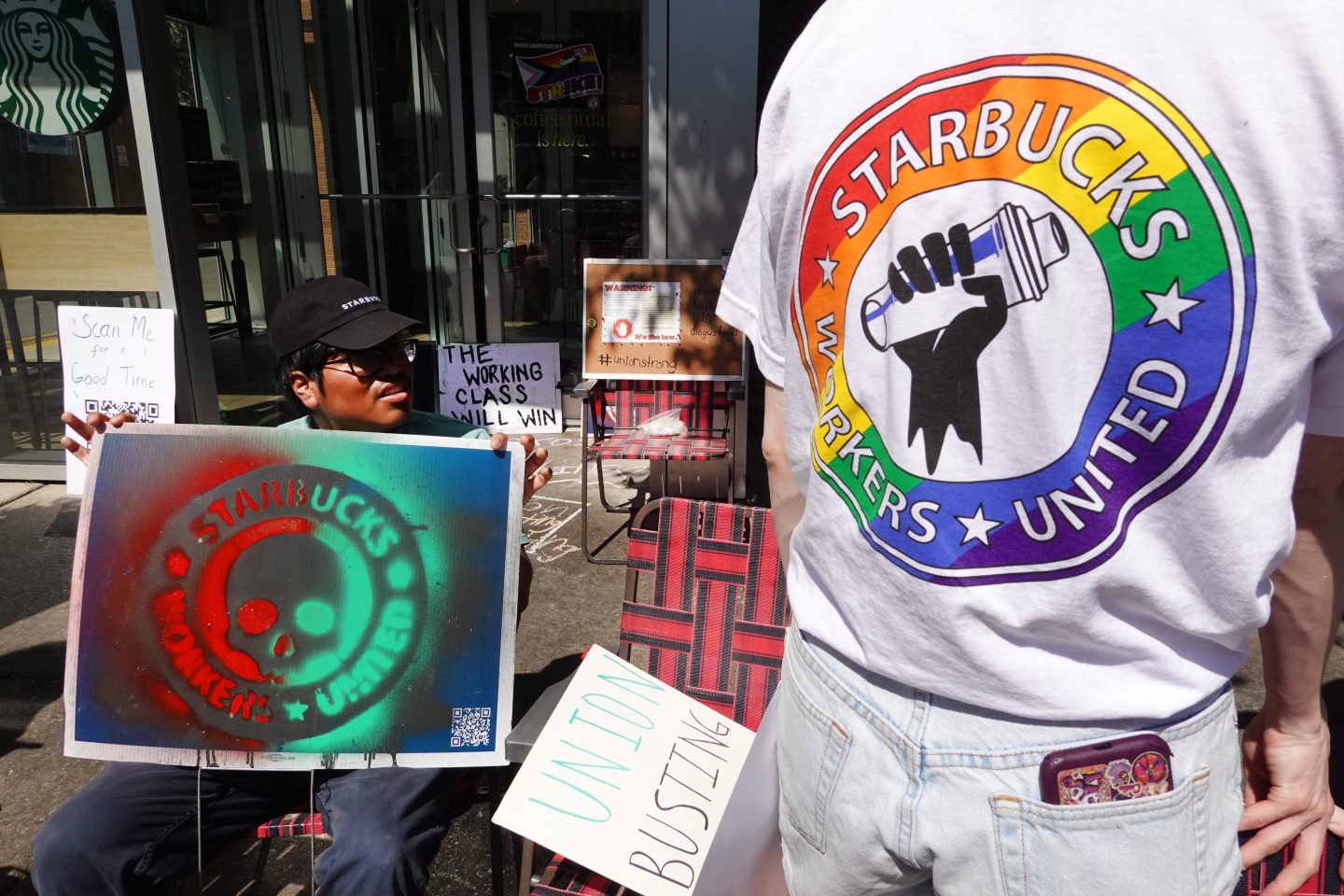 People picket in front of a Starbucks store in the Greektown neighborhood on June 24, 2023 in Chicago.