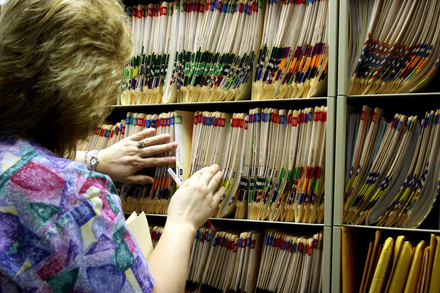 Women at filing cabinet