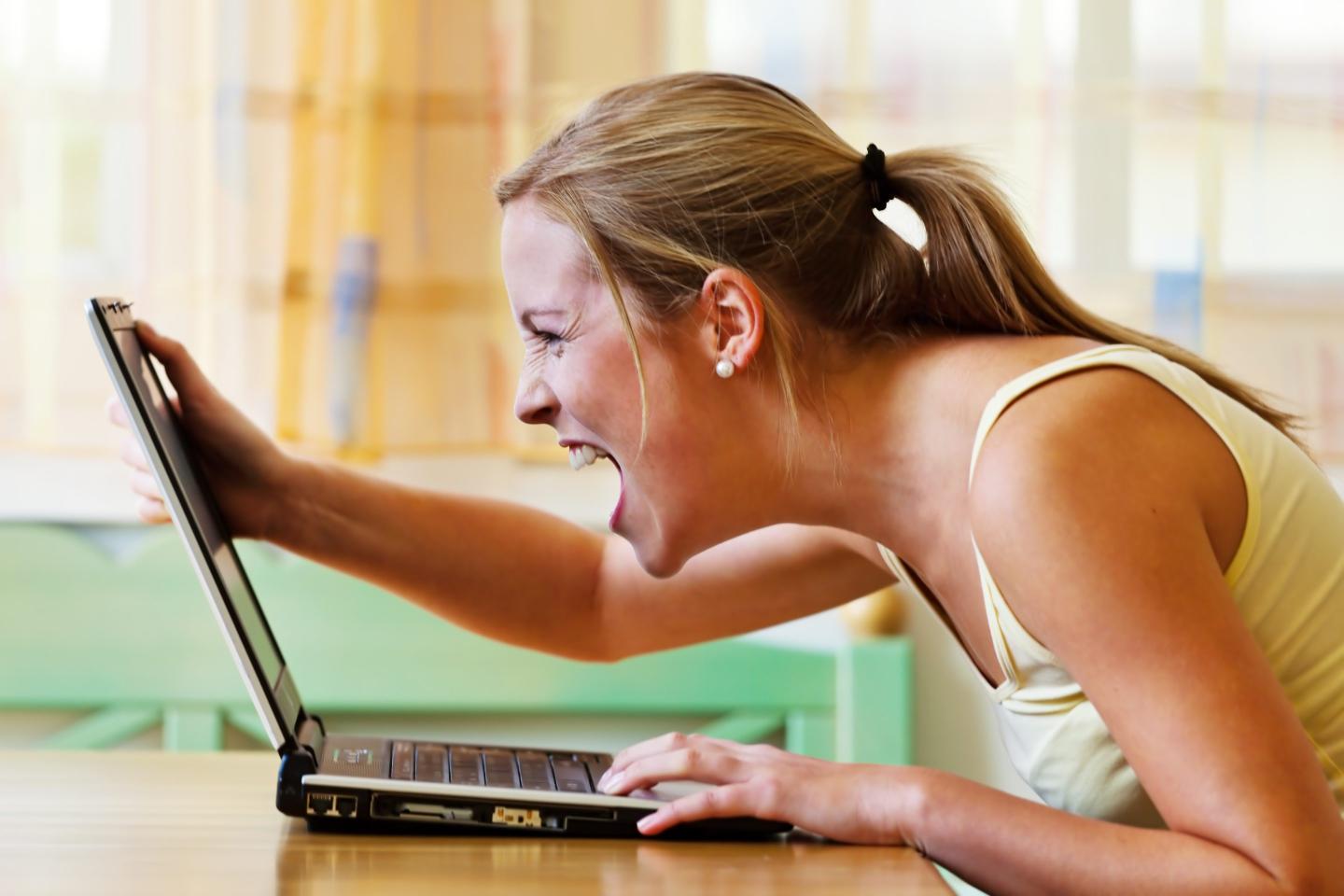 woman is angry about her computer