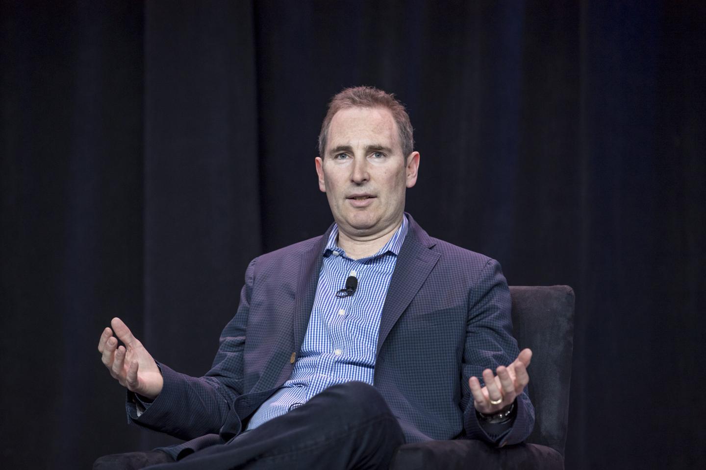 Amazon CEO Andy Jassy on stage at an event.