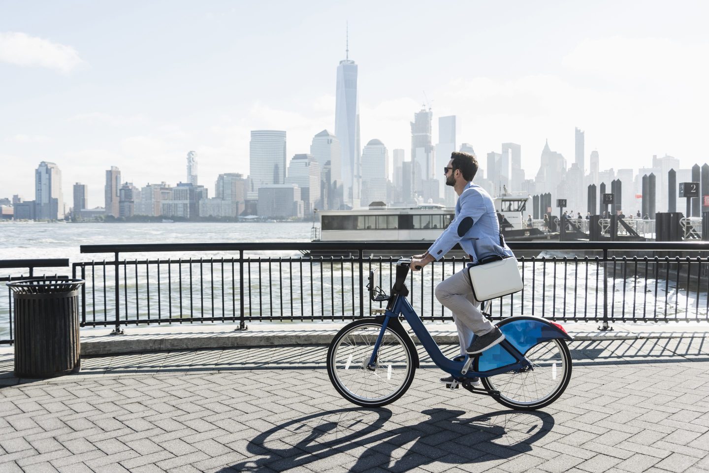 Man cycling with view of new york