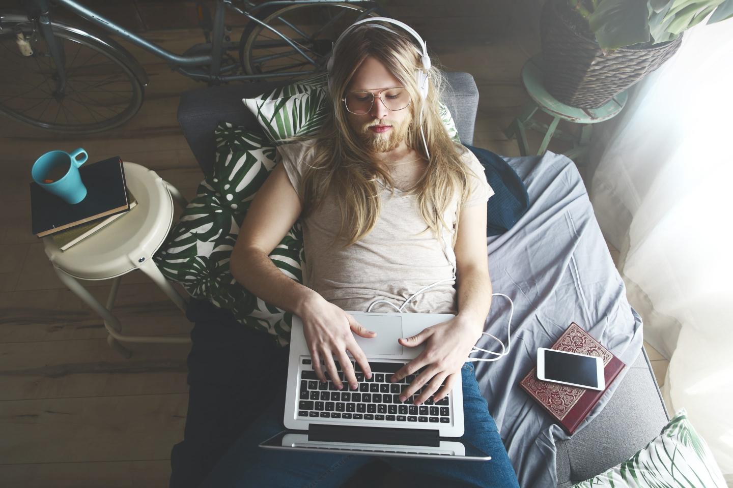 Man on couch with laptop