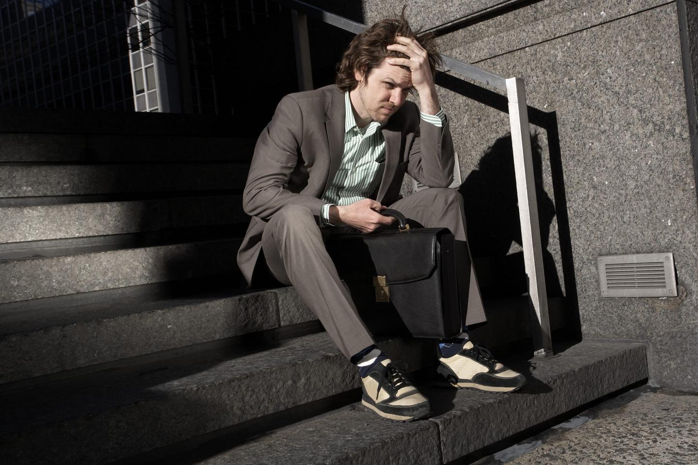 A man in a suit looking worried. 