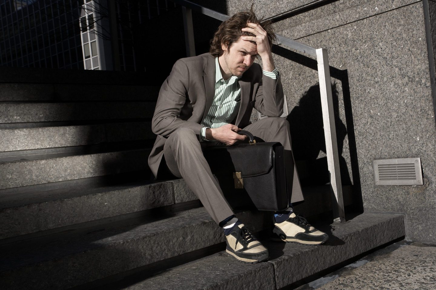 A man in a suit looking worried.