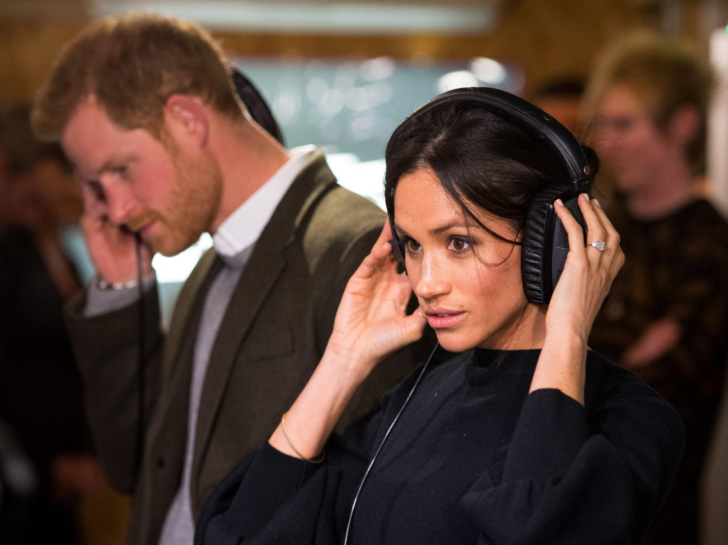 Meghan Markle and Prince Harry listen to music